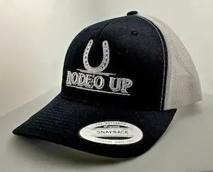 A black and white hat with the words rodeo up on it.