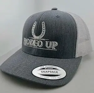 A cowboy hat with the words rodeo up on it.