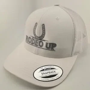 A white hat with the words rodeo up on it.